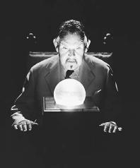 Charlie Chan portrayed by actor Sidney Toler as he gazes into a crystal ball. (CORBIS CORPORATION)