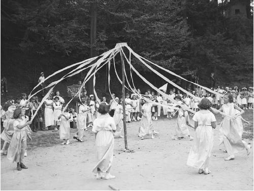 Group of young women performing the Maypole dance. (CORBIS CORPORATION)